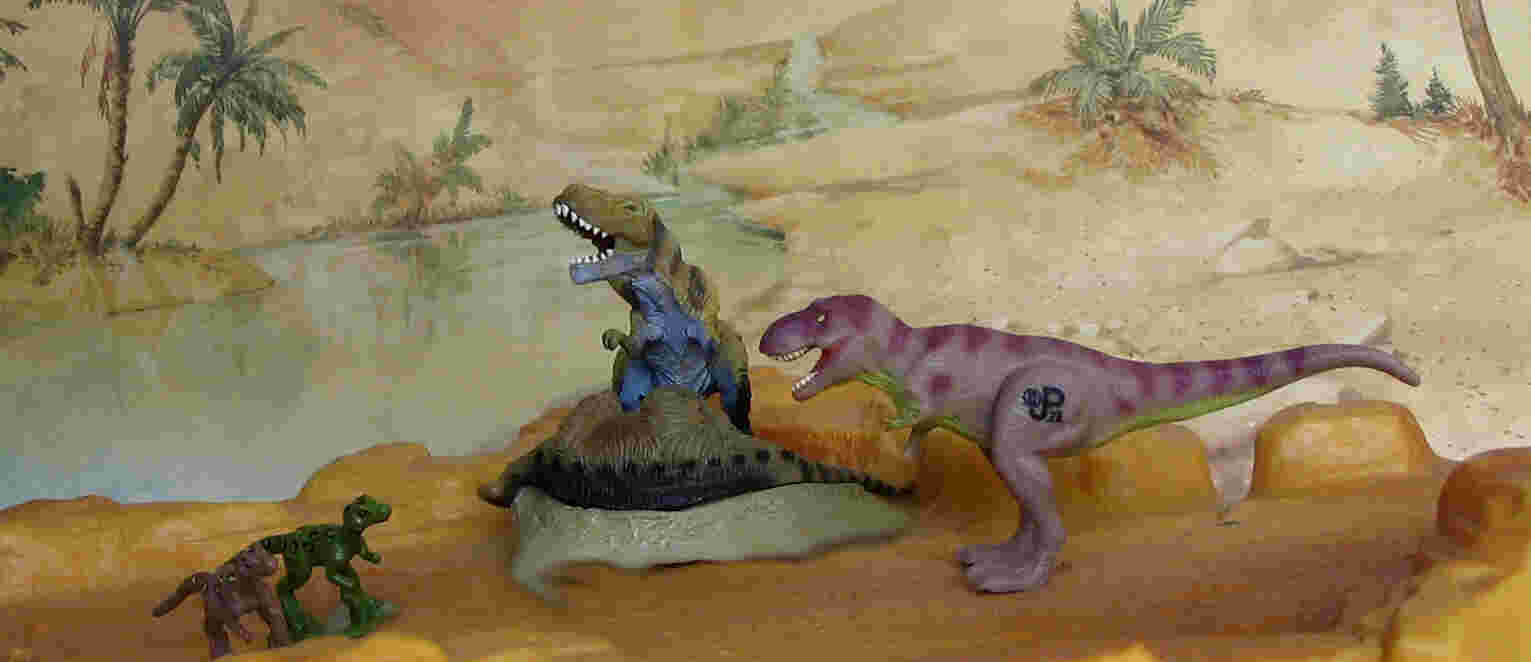 Bandai Tyrannosaurus with lambosaurine carcass. The two chicks are from a JP figure set some of which were also included with the action figures. The adult JP Tyrannosaurus from a mini playset.